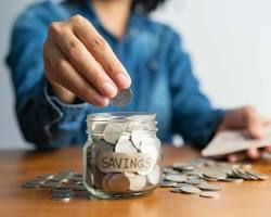 Image of person saving money