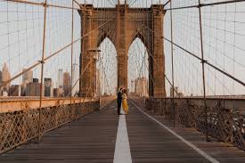 Against the manhattan skyline one of the best and most popular locations for a photo op on the brooklyn bridge is on the brooklyn side of the two massive archways. Brooklyn Bridge Engagement Photos Your Guide To Taking Epic Photos On This Iconic Bridge