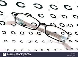Black Glasses On A Eye Sight Test Chart Stock Photo
