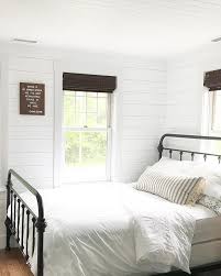 Simple White Farmhouse Bedroom With White Shiplap And Black Metal Bed Remodel Bedroom White Bedroom Decor Simple Bedroom