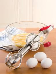 Antique eggbeater with baby blue handle. Vintage Egg Beater Made With Stainless Steel