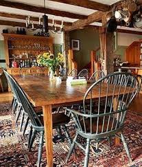 This great room features beautiful holiday decorations. Colonial Home Colonial Dining Room Bohemian Dining Room Decor Primitive Dining Rooms