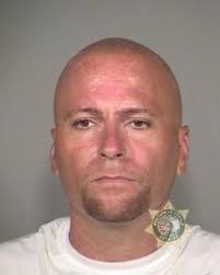 Portland police accuse a 43-year-old man of firing off an AR-15 rifle from  a North Hayden Island condo