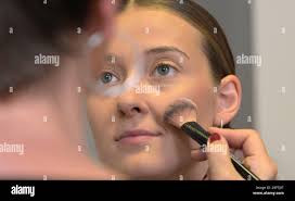 Dresden, Germany. 01st Aug, 2023. Sarah Straube is styled for the photo  shoot for the annual picture calendar of the Dresdner SC women's volleyball  team at the "Art-n-Photo" photo studio. Credit: Matthias