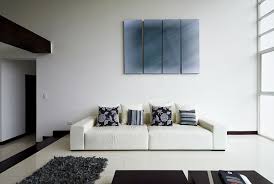 The white color also gives a wider impression in the interior of your minimalist living room. White Minimalist Living Room With White Couch With Black Cushion Free Download