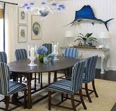 Enjoy nautical lighting made from coastal materials such as iron, brass, copper, driftwood, sea glass, nautical rope, and more. Nautical Decor Ideas And Designs By Phoebe Howard Beach Dining Room Beach House Dining Room Dining Room Design
