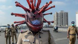 Collect photographs from the retirees life and have them scanned and running in a loop on a television or computer. India Lockdown Police Officer Wears A Coronavirus Helmet To Warn People To Stay Inside Cnn
