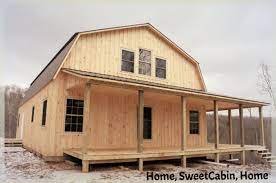 Single story gable style cabin with log siding and 4' porch. Gambrel Cabins
