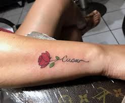 For a truly striking design, have the tattoo artist create the rose and then use a scripted version of your chosen person's name in lieu of a traditional stem. Rose Tattoo Yet Another Classic One