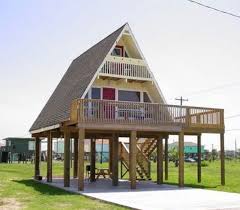 Beach house plan with walkout sundeck. This Is It My A Frame On Stilts I Finally Found One A Frame House House On Stilts Architecture