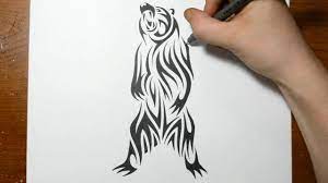 The far top of each tattoo is a stripe of slight reddish hue, showing the bear's body fading away. Drawing A Grizzly Bear Tribal Tattoo Design Style Youtube