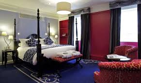 Modern bedroom of a hotel attached to a bathroom. Hotel Review Francis Hotel Bath Mgallery