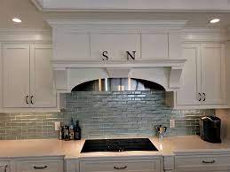 Features white cabinets, aqua walls and a white subway tile backsplash for a refreshing look. Glass Tiles Mosaics For Kitchen Backsplash Floors And Walls