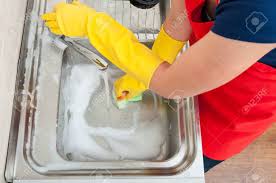 It's no wonder, then, that they can also be the dirtiest. Female Housekeeper Cleaning The Kitchen Sink With Sponge At Home Stock Photo Picture And Royalty Free Image Image 81890060