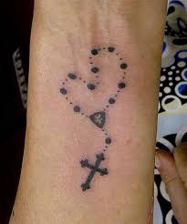 The tattoo can also be accompanied by other designs such as a cross, rosary beads or flowers. The 115 Best Rosary Tattoos For Men Improb