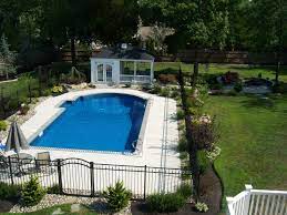 Refreshing A Swimming Pool Landscape All About The House Swimming Pool Landscaping Backyard Pool Landscaping Inground Pool Landscaping