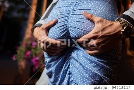 Close up of a man's hand touching a woman's butt. - Stock Photo [94512114] - PIXTA
