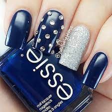A combination of matte and glossy blue nails with white bow. 23 Blue Nail Designs Best Nail Art Designs 2020