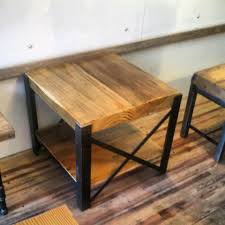 The beautiful reclaimed wood finish is framed by black steel and incorporates decorative round elements on the sides and back. Reclaimed Wood And Steel Coffee Table X Frame Style Mobilier De Salon Deco Table Deco