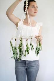 Keep your diy kitchen herb garden in a nice warm out of the way area that gets at least a little sun while you are waiting you can make your hangers for your pots in your diy kitchen herb garden. This Diy Herb Drying Rack Is The Kitchen Accessory You Didn T Know You Needed Hello Glow