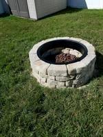 If you don't need a complete fire pit but still need to contain the fire, such as when camping, a fire ring can be placed around it but directly on the ground, so your fire is created on the ground. Firepit Kit 43 5 In X 12 5 In Fire Pit Lowes Com Fire Pit Backyard Fire Pit Kit Sloped Garden