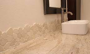 Copper elements add shine to the design. Grouting The Live Edge Pebble Tile Backsplash Beckwith S Treasures