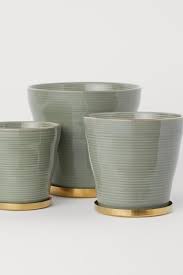 Fluted Plant Pot With A Saucer Khaki Green Home All H M Gb Large Plant Pots Small Potted Plants Potted Plants Drainage holes allow water to drain from the soil promoting good air flow through the roots and flushing out the excessive salts that have built up in the soil.