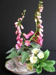 C_ 7 if you have problems with your eyes and need to buy glasses, you go to this place. Foxglove And Primrose Arrangement Cold Porcelain Flowers Flower Decorations Flower Spray
