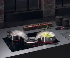 The Bora Basic System Consists Of A Powerful Induction Hob Combined With An Efficient Extractor Placed At Kitchen Tech Cooking Kitchen Modern Kitchen Cabinets