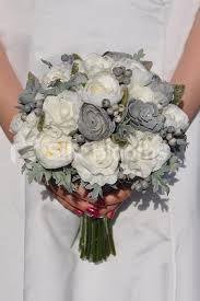 How do you choose a wedding bouquet? Stunning Fresh Touch Ivory Rose Grey Ranunculus Bridal Bouquet With Succulent And Berries Rose Bridal Bouquet Ranunculus Bridal Bouquet Wedding Bouquets