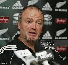 New Zealand All Black's coach Graham Henry walks