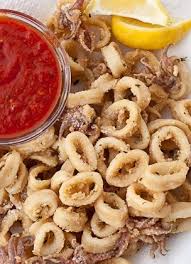Fried Calamari Squid Tubes And Tentacles Deep Fried After Being Dredged In Flour Seasoned With Parsley Fried Calamari Cooking Calamari Cuttlefish Recipes
