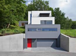 Berschneider Berschneider Einfamilienhaus Kuben Aussenansicht Sichtbeton Garage Aufzug Einfamilienhaus Haus Hanglage Haus Aussendesign