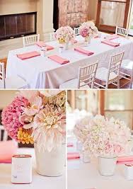 Simple Blush Pink Flower Arrangements White Table Cloth Covers And Darker Shade Pink Napkins Baby Shower Flowers Bridal Shower Tables Blush Pink Baby Shower