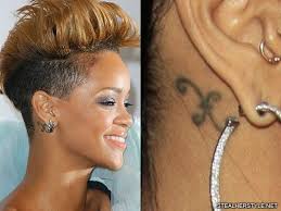 Of all rihanna's tattoos, she claims that the outline of a star on her inner left ear was the most painful one to get. Rihanna S Tattoos Meanings Steal Her Style