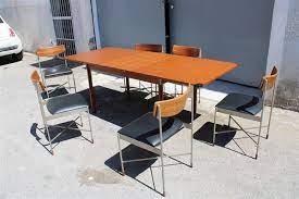 Maybe you would like to learn more about one of these? Italian Extendable Teak And Metal Dining Table Chairs Set 1960s Set Of 7 For Sale At Pamono