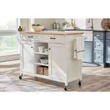 The home decorators collection ivory wood kitchen island with natural butcher block top is a nice looking butcher block top that can be used for a this island also has a distressed oak finished top for an aged look. Home Decorators Collection Rockford White Kitchen Cart With Butcher Block Top Sk19238e5r1 W The Home Depot White Kitchen Cart Mobile Kitchen Island Freestanding Kitchen Island