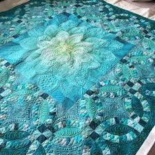 Wedding quilts are perfect for quilters looking to create quilts filled with memories. Finished This Gorgeous Quilt For Nancy She Made This As A Wedding Gift For Her Grandson Customquilting Qui Flower Quilt Patterns Whole Cloth Quilts Quilts