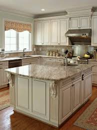 White Cabinets With Glaze Sand Colored Granite Decorative Accents On Island Antique White Kitchen Cabinets Antique White Kitchen Eclectic Kitchen