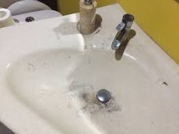 badly stained bathroom sink in royal