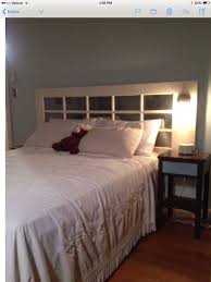 My New Headboard Made From An Old Mirrored Glass French Door With A Vintage Light Sconce Installed Headboard With Lights Headboard From Old Door Old Door Decor