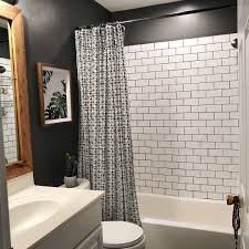 Black And Gray Bathroom Tiles Diy Bathroom With Dark Grey Walls Crips White Subway Tile And Black Grout Clean Modern And Neutral Bathroom Decor Diy Bathroom Remodel White Bathroom Tiles
