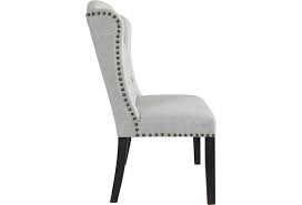 Upholstered in a grey linen weave fabric that feels relaxed and sophisticated all at the same time. Ashley Furniture Jeanette Dining Upholstered Side Chair With Tufted Wingback And Nailhead Trim Value City Furniture Dining Side Chairs