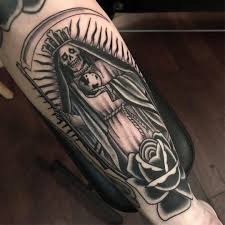 Similarly, the black rose tattoo can also signify that the owner is grieving or was grieving when they got the tattoo. Ross K Jones La Santisima Muerte And A Black Rose Of Death Made
