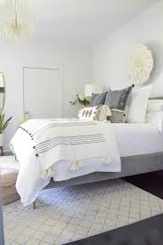 This attic bedroom with boho chic setting also holds a blend of rustic and luxurious due to the oak wood beams and the classy chandelier. Boho Chic Summer Bedroom Tour Zdesign At Home