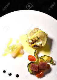 This shrimp ceviche recipe is fresh shrimp marinated with cucumber, red onions, cilantro, avocado and diced jalapenos. Fine Dining Seafood Appetizer With Tuna Sashimi Octopus Salad Stock Photo Picture And Royalty Free Image Image 50815554