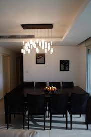 Angle the arms of this highly adjustable fixture to strike a sense of balance that best suits your dining table. Elegant Chandelier Rain Drops Pendants Modern Dining Room Miami By Galilee Lighting Houzz