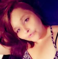 Baby deer alone in parking lot