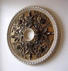 The clear rosettes can be painted to match your decor. How To Paint A Ceiling Medallion Destashio
