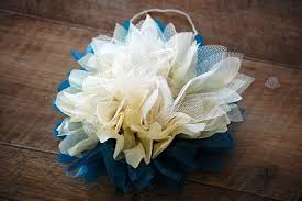 Then add a strand of ribbon to the pipe cleaner loop, for hanging. How To Make Tulle Flowers Gathered